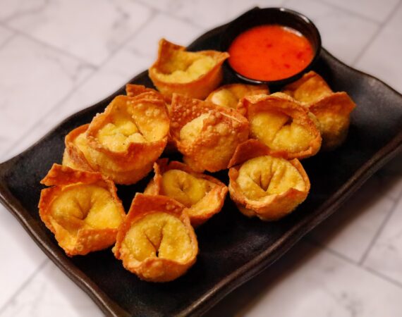 crab and cheese wontons with a sauce on side